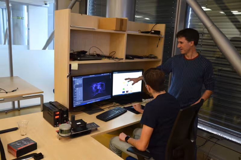 Michal Sojka explaining a problem to a student.